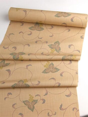 A tsumugi kimono woven in Tango, featuring an arabesque pattern in orange